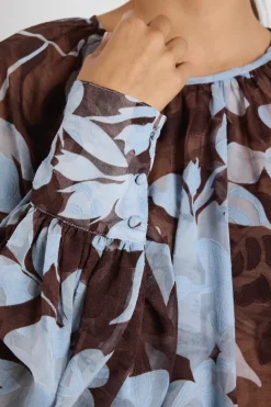 Stories be Told Cosmopolitan Chocolate Blue Floral Crew Neck Floaty LS Top