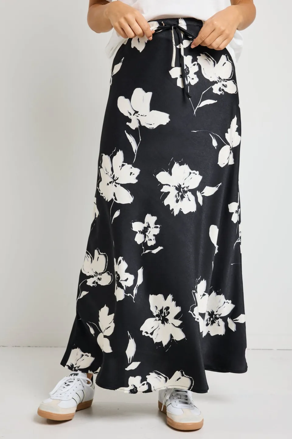 Stories be Told Critical Black Floral Satin Tie Waist Bias Maxi Skirt