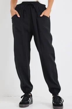 Among the Brave New Warrior Black Relaxed Drapey Drawstring Stretch Cuff Pant